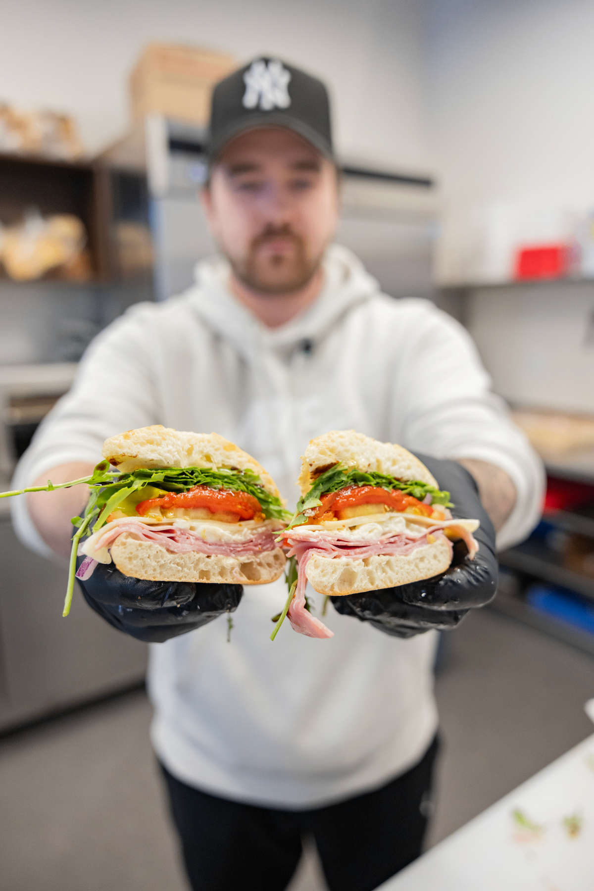 Austin holding a finished sandwich